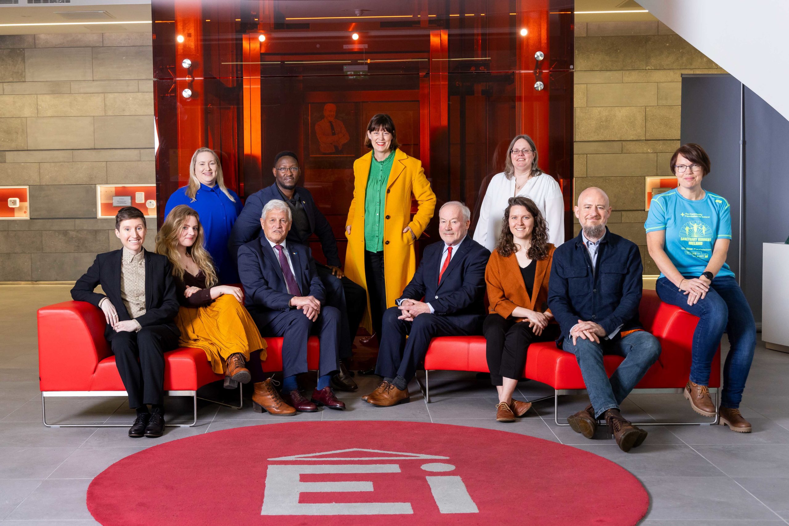 A group photo including the nine awardees of the Impact Fund for Munster 2023.