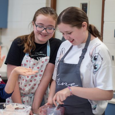 Two young girls baking