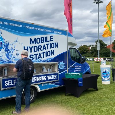 Large truck with a water refill station open from the side of the truck