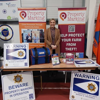 Woman at a desk displaying lots of different signage