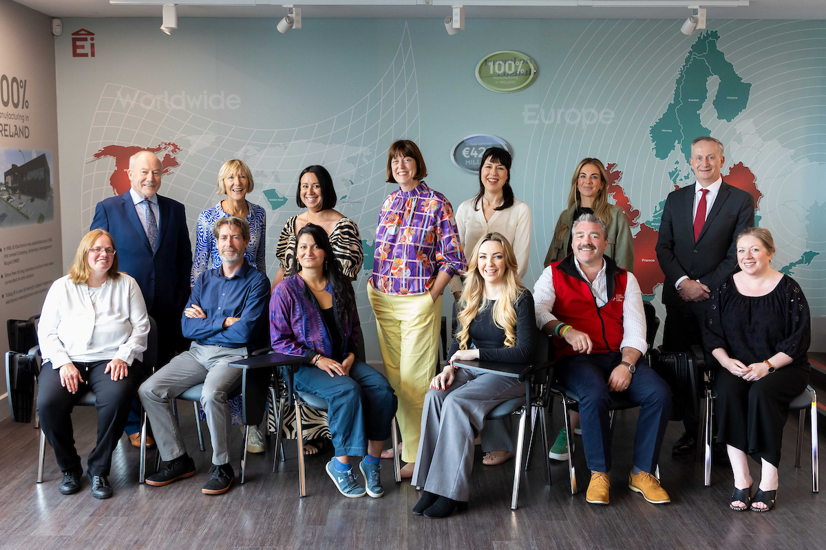 Large group of people posing for the camera smiling