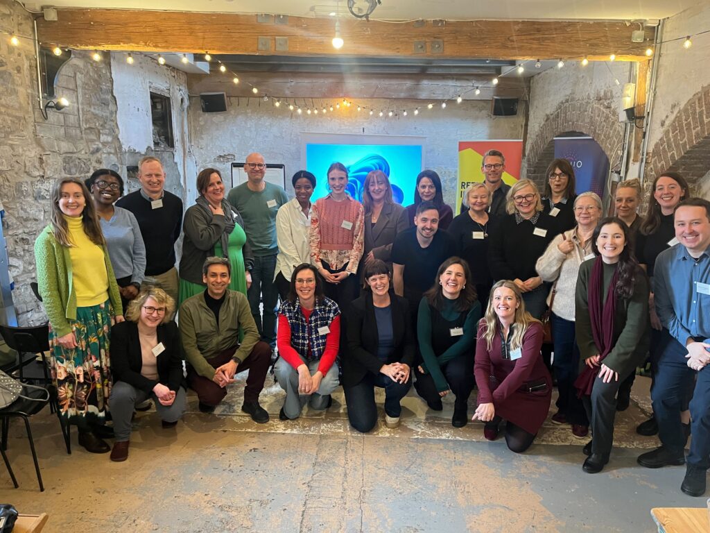 Big group of INSISST consortium partners smiling to the camera