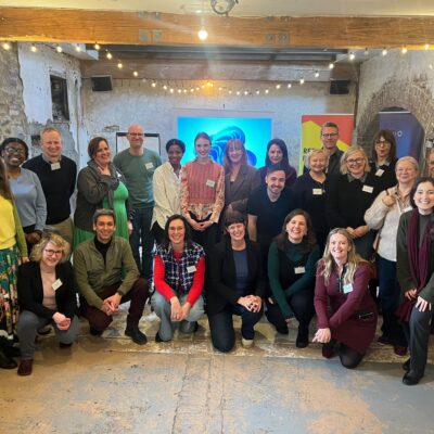 Big group of INSISST consortium partners smiling to the camera