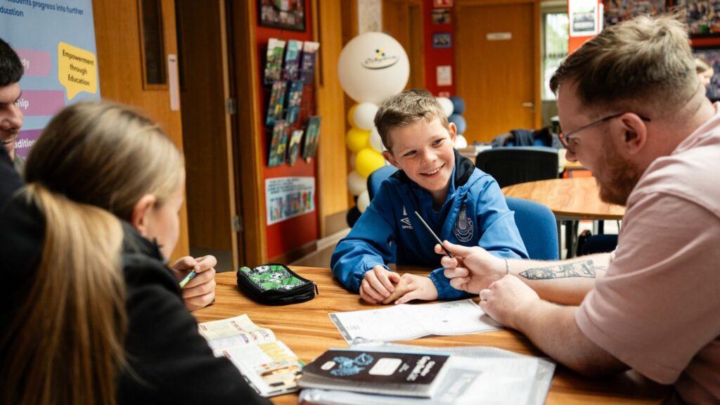 Young person talking to an older person about home work
