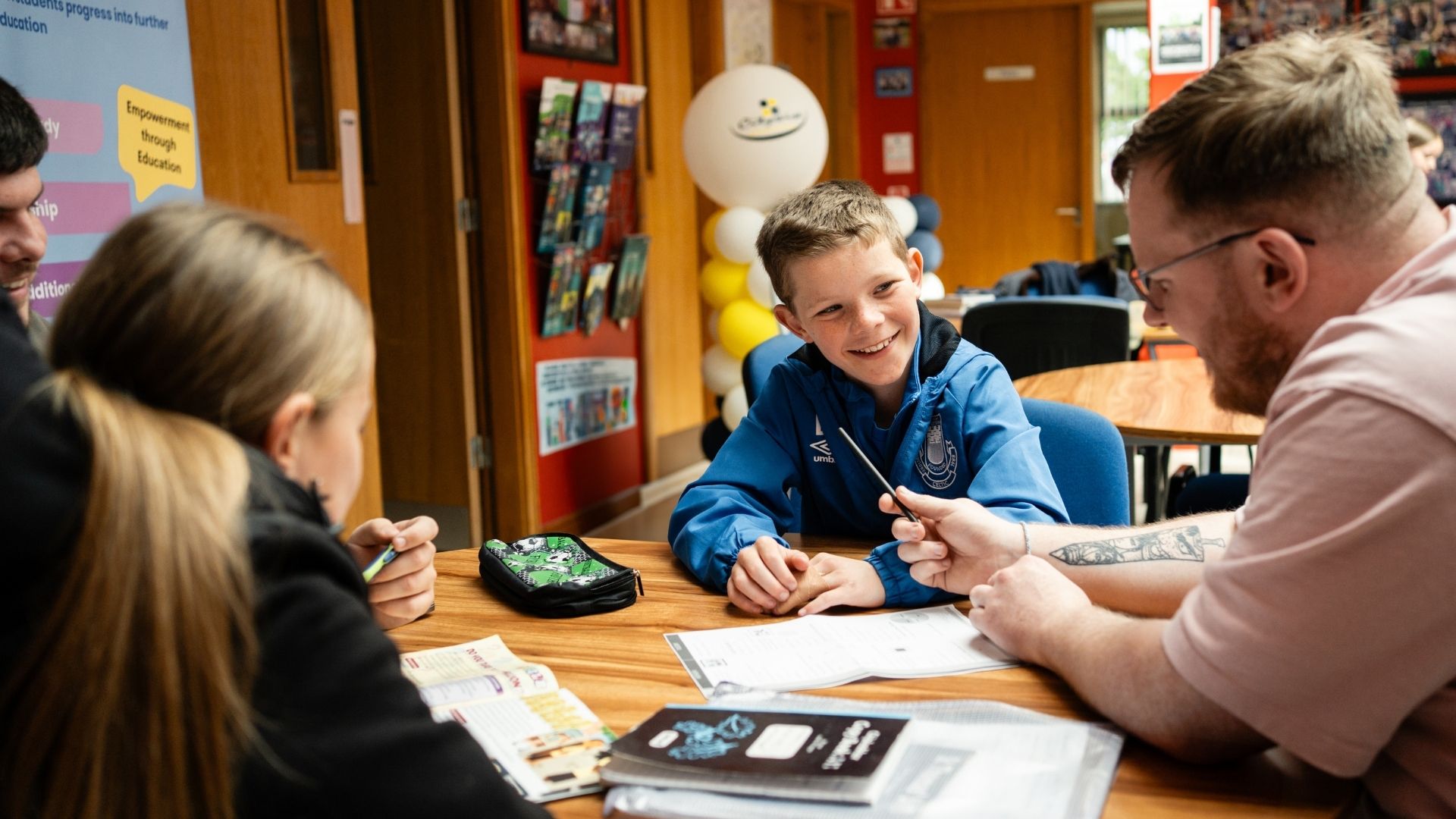 Young person talking to an older person about home work