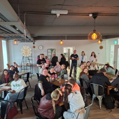 Large group at tables in a large room